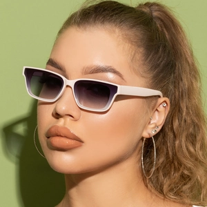 Detail of square white frame sunglasses with gradient lenses worn by a fashion model