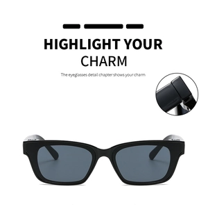 Detail view of square black sunglasses with close-up of durable metal hinge craftsmanship