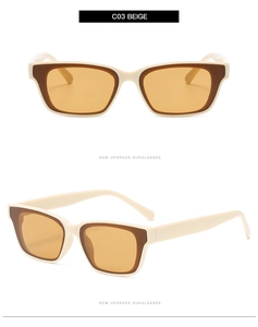 Detail view of beige square sunglasses with orange lenses and wide temple design