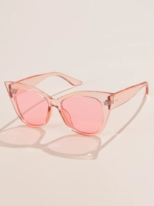 Detail of pink cat eye sunglasses showing transparent PC frame and tinted lenses