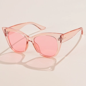 Trendy oversized pink cat eye sunglasses with transparent frames and retro rice nail detail