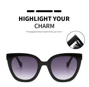 Detail of metal hinge and cat eye sunglasses with purple gradient lenses