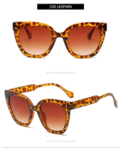 Detail view of retro cat-eye sunglasses featuring leopard tortoise frames and brown lenses