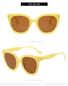 Detailed view of yellow cat eye sunglasses with thick temples and amber lenses