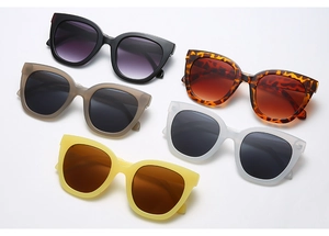Flat lay of retro square sunglasses collection in diverse frame colors and tinted lenses