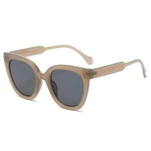 Modern oversized translucent khaki square cat-eye sunglasses with dark grey lenses