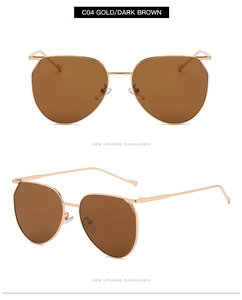 Detail view of oval gold metal sunglasses with dark brown lenses from dual perspectives
