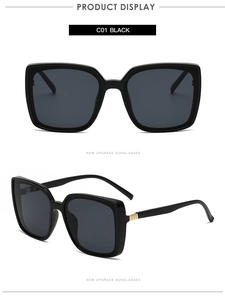 Detail of square oversized black sunglasses with premium gold textured temple hinges