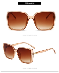 Detail view of square oversized brown sunglasses with metal hinges and gradient lenses
