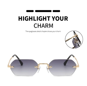Detail view of purple gradient lens and gold metal hinge on rimless sunglasses