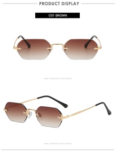 Close-up of frameless hexagonal sunglasses with brown gradient lenses and gold metal temples