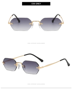 Detail of rimless octagonal sunglasses with gradient grey lenses and golden metal frame