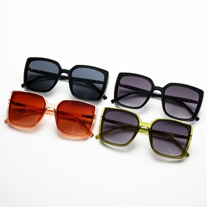 Set of four vintage oversized square sunglasses in black, orange, and green frames