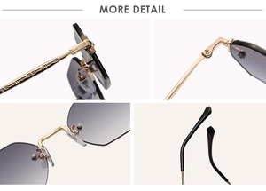 Detail view of engraved golden metal temples and grey gradient lenses on rimless sunglasses