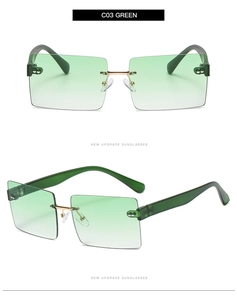 Macro detail of rimless square sunglasses with green gradient lenses and gold metal hinges