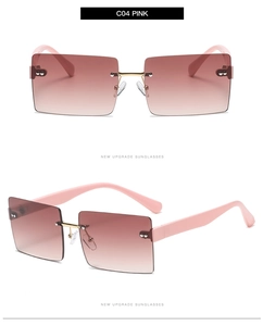 Detail of pink gradient lenses and gold metal bridge on rimless square sunglasses