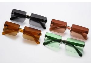 Detail view of four frameless rectangular sunglasses in gradient tints with metal hinges