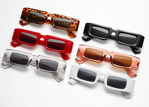 Collection of retro narrow rectangular sunglasses in leopard, black, red, and white colors