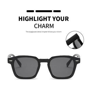 Detail shot of black geometric sunglasses frame with silver metal rivet accents