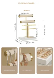 Modern gold jewelry tower featuring tiered necklace bars, earring racks, and ring base