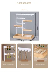 White metal jewelry tower with wood base showing detailed dimensions and earring slots