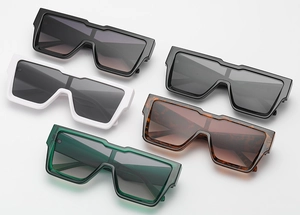 Flat lay of retro square oversized sunglasses in black, white, and tortoiseshell colors