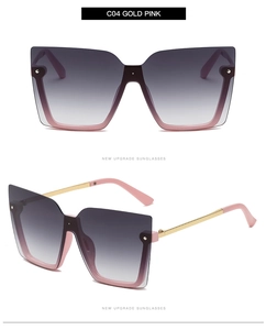 Detail view of gold pink square sunglasses with gradient lenses and metal temples