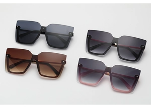Flat lay of square semi-rimless sunglasses in black, grey, tea, and pink gradient colors