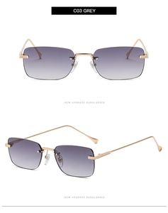 Detail of rimless square grey gradient sunglasses with textured gold metal temples