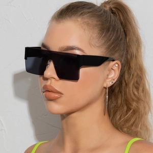 Chic oversized square sunglasses with black one-piece lenses and chunky frames for women