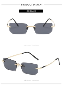 Detail view of rimless square sunglasses with black lenses and gold metal temples