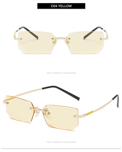 Detail view of square rimless sunglasses with yellow lenses and golden metal frame