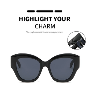 Detail of trendy cat-eye sunglasses featuring wide temples and geometric 3D cut craftsmanship