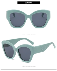 Detail of light blue cat eye sunglasses with wavy temples and dark grey lenses