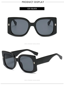 Macro view of C01 black oversized square sunglasses with dark lenses and metal studs