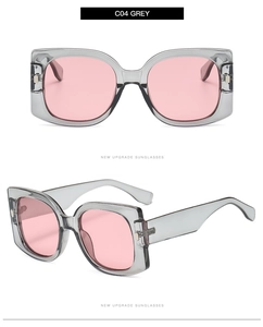 Detail view of retro square gray frame sunglasses with pink lenses and side temple design