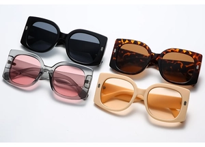 Detailed flat lay of oversized square sunglasses in four color variants with metal accents