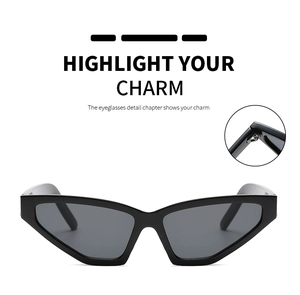 Detail view of cat eye sunglasses with reinforced metal hinges and dark grey lenses