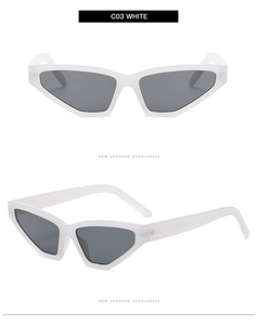 Detailed view of white triangle cat-eye sunglasses with gray lenses and sharp frame