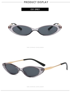 Close-up of grey translucent cat-eye sunglasses with gold metal temples and C01 label