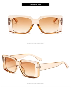 Detail of square amber brown sunglasses with metallic rivets and gradient lenses