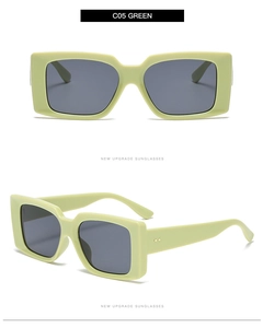 Detail view of vintage light green square sunglasses with dark grey lenses and metal rivets