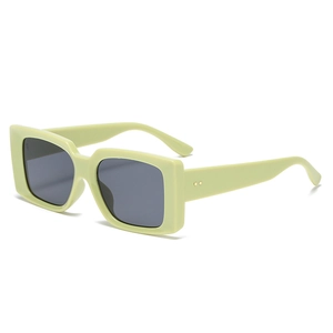 Vintage rectangle sunglasses in lime green with thick frames and side metal rivets
