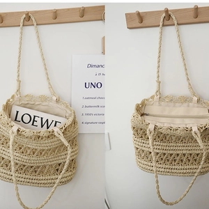 Chic hollow straw tote bag with wave lace trim and zipper closure for beach vacations