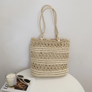 Hollow out straw tote bag for summer beach holidays featuring minimalist woven design