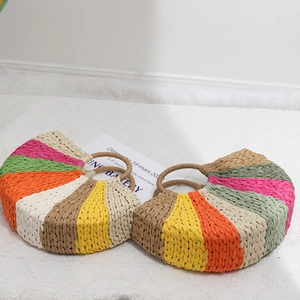 Rainbow striped straw handbag in a semi-circle design with circular woven handles