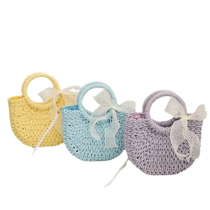 Straw weave crossbody bags with ribbon bows and pearl straps in yellow, blue and purple