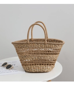 Macro detail of the handwoven hollow straw patterns on this French vintage beach basket