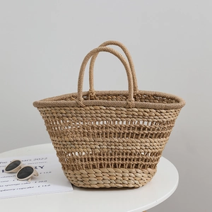 French vintage hollow-out straw handbag with circular handles for summer beach vacations