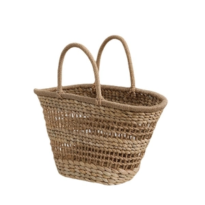 French retro hollow straw handbag with dual handles for summer beach vacations
